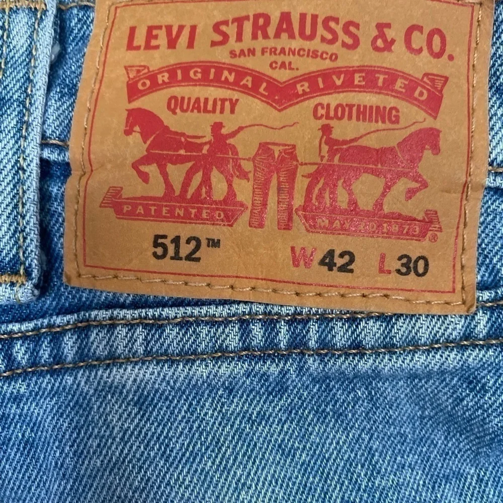 Men’s Levi’s 512 42 x 30 light wash distressed denim jeans